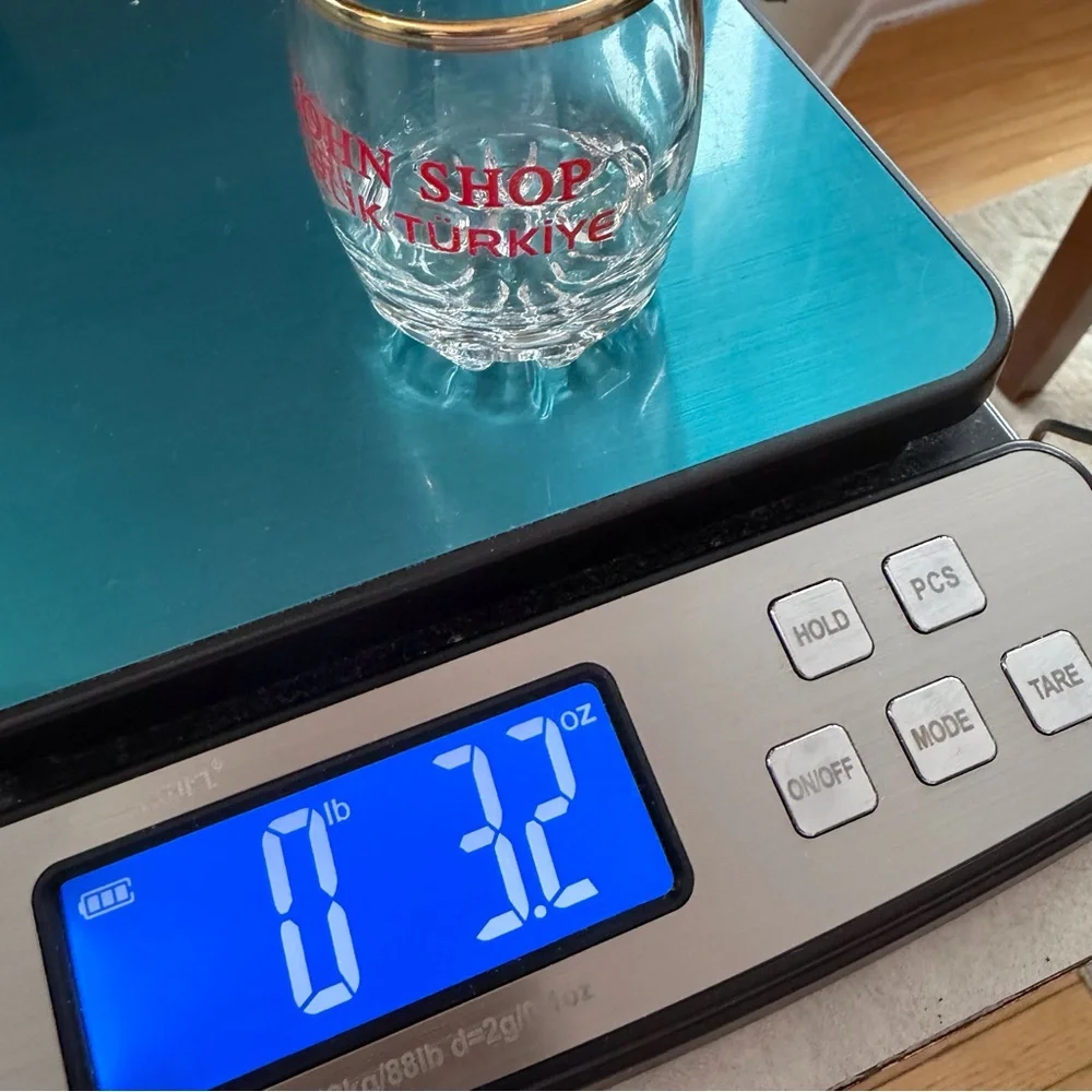 VTG I John Shop in‎ Incirlik, Türkiye shot glass in a gold rim & bold red text